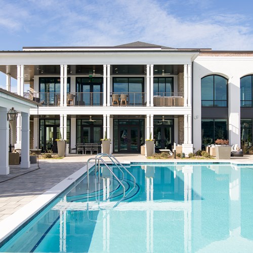 picture of pool with view of clubhouse in the background